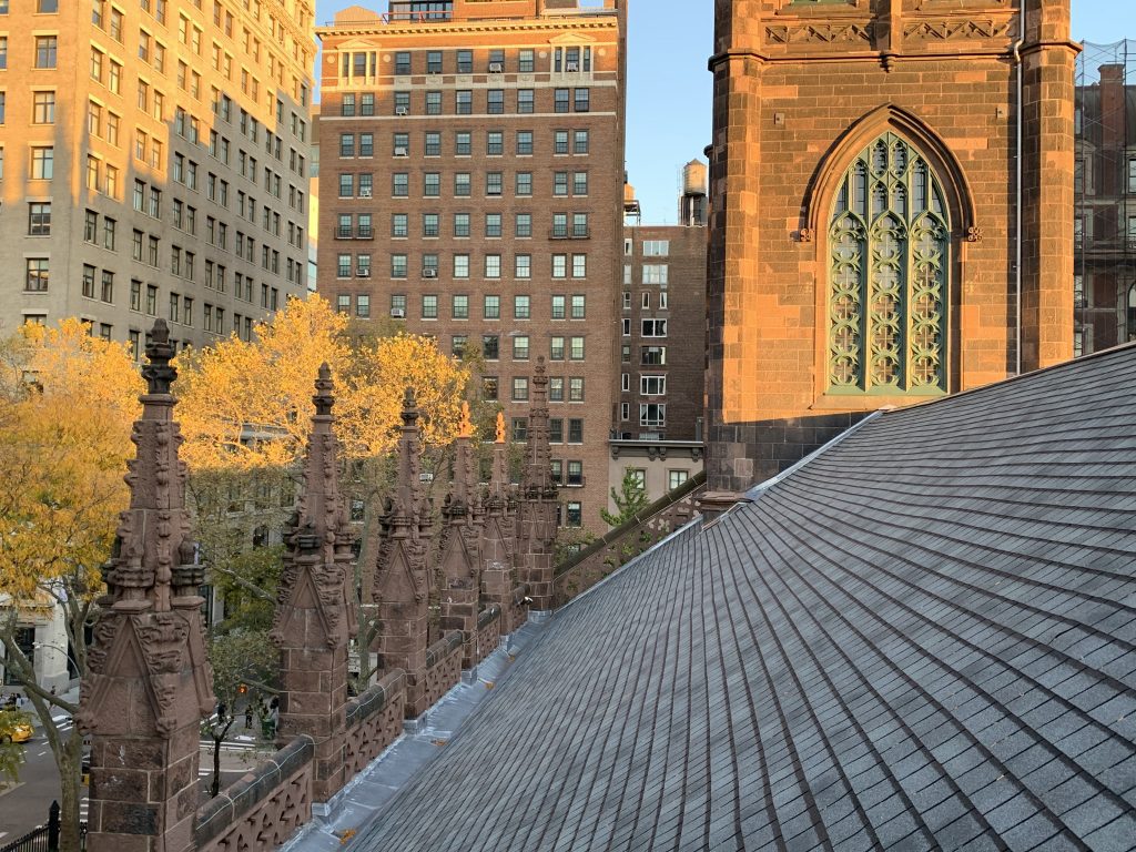 Historic building roof with asphalt shingles in place of slate