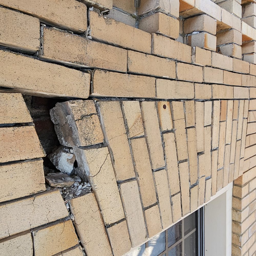 Cracked and broken brick masonry.