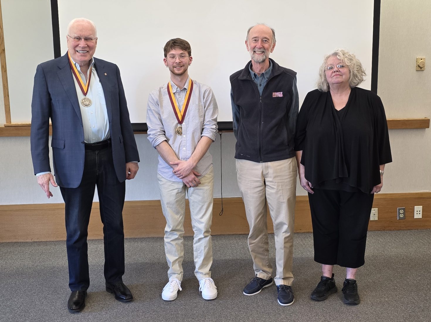 Awardees, two with medals, at the Tau Sigma Delta Honor Society luncheon in April 2026