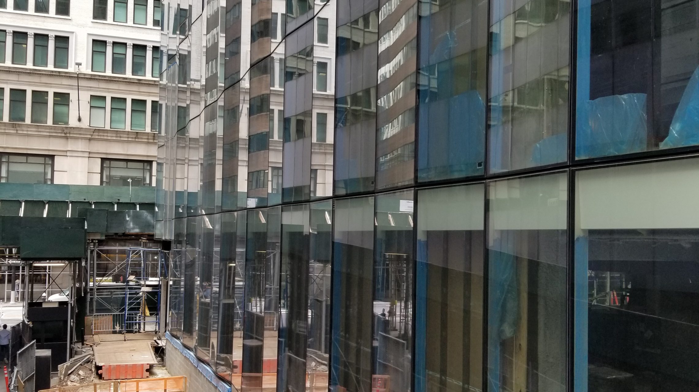Installation of a new glazed curtain wall facade at a historic building as part of an adaptive reuse
