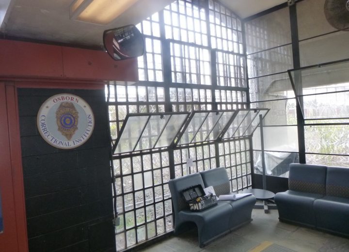 Replacement windows viewed from the interior of a common space at a state prison