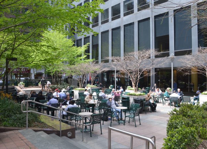 A verdant plaza provides a visual counterpoint to the midcentury office tower at 1166 Avenue of the Americas