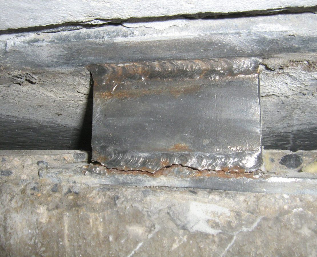 Abrupt failure between tee and shear wall