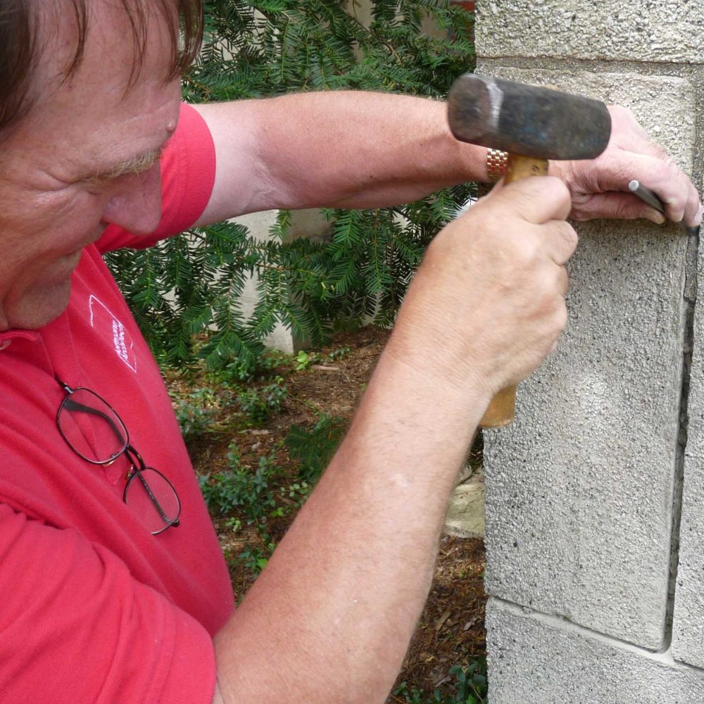 Art Sanders working on a building