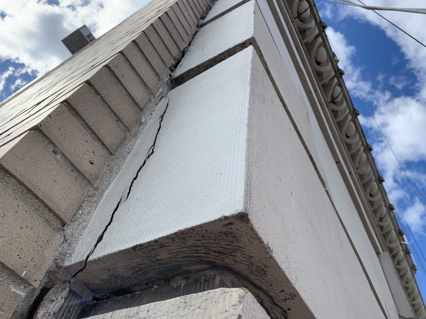 Cracked terra cotta on a building facade