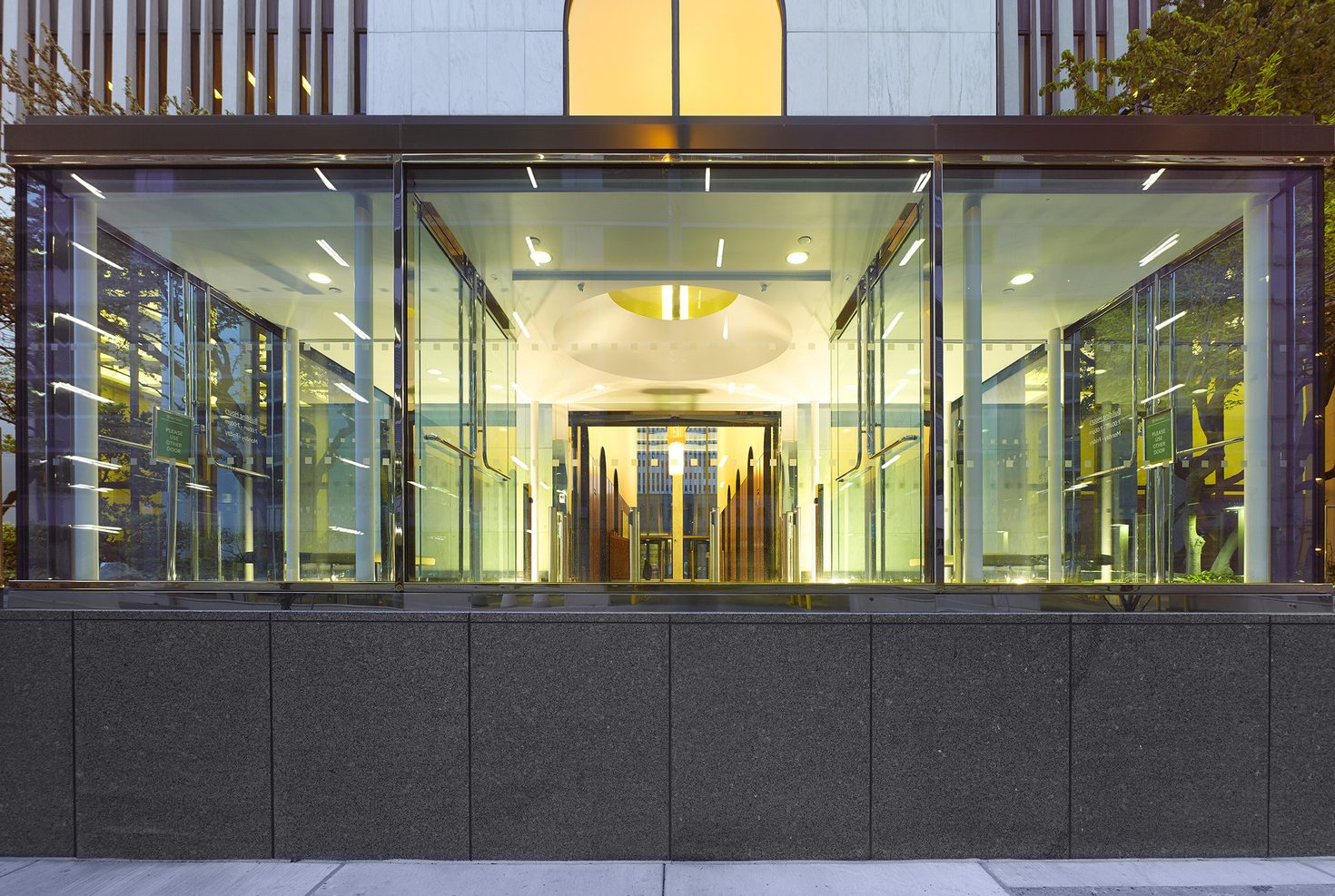 Redesigned entrance vestibule provides added security while respecting the original design vision of the midcentury tower