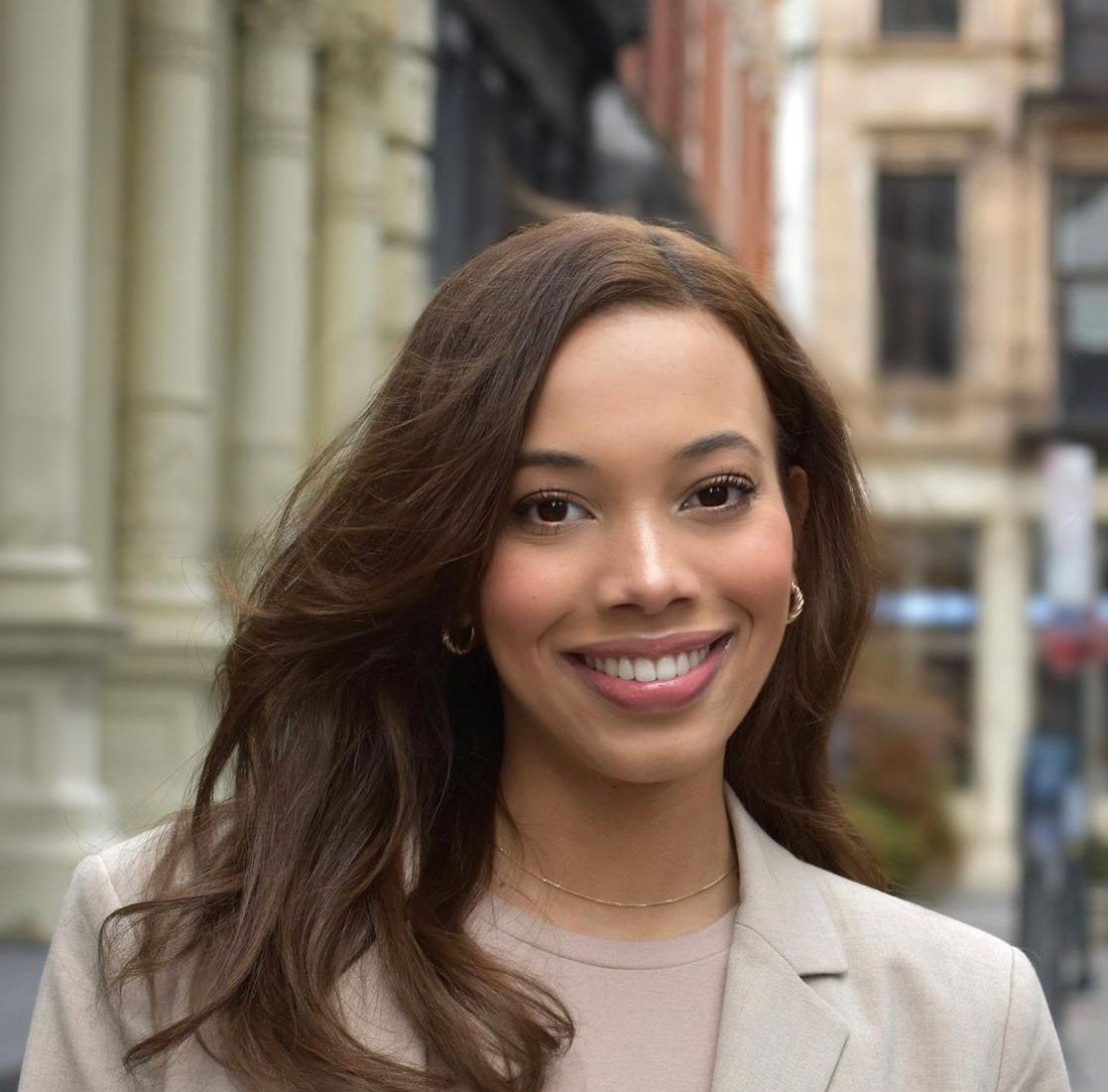 portrait of young woman in city setting