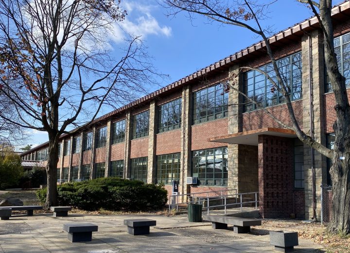 View of one of the entrances to the deceptively large, serpentine SUNY Farmingdale Lupton Hall, with the newly installed copper roof above