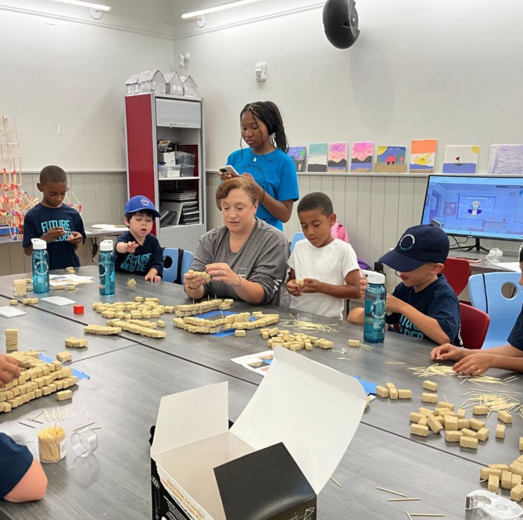 Students work with architect Erin Kesegi in an architecture camp