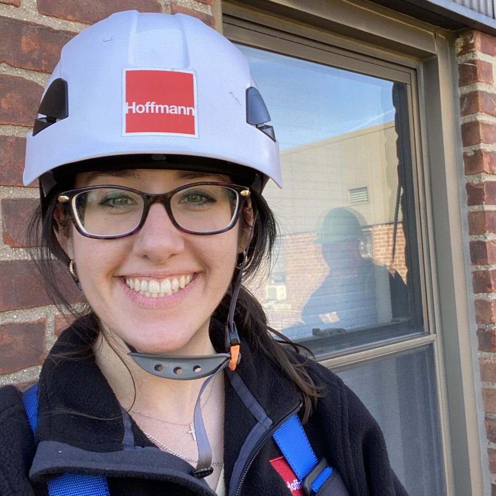 Kristen Anderson wearing a Hoffmann hardhat on a project site